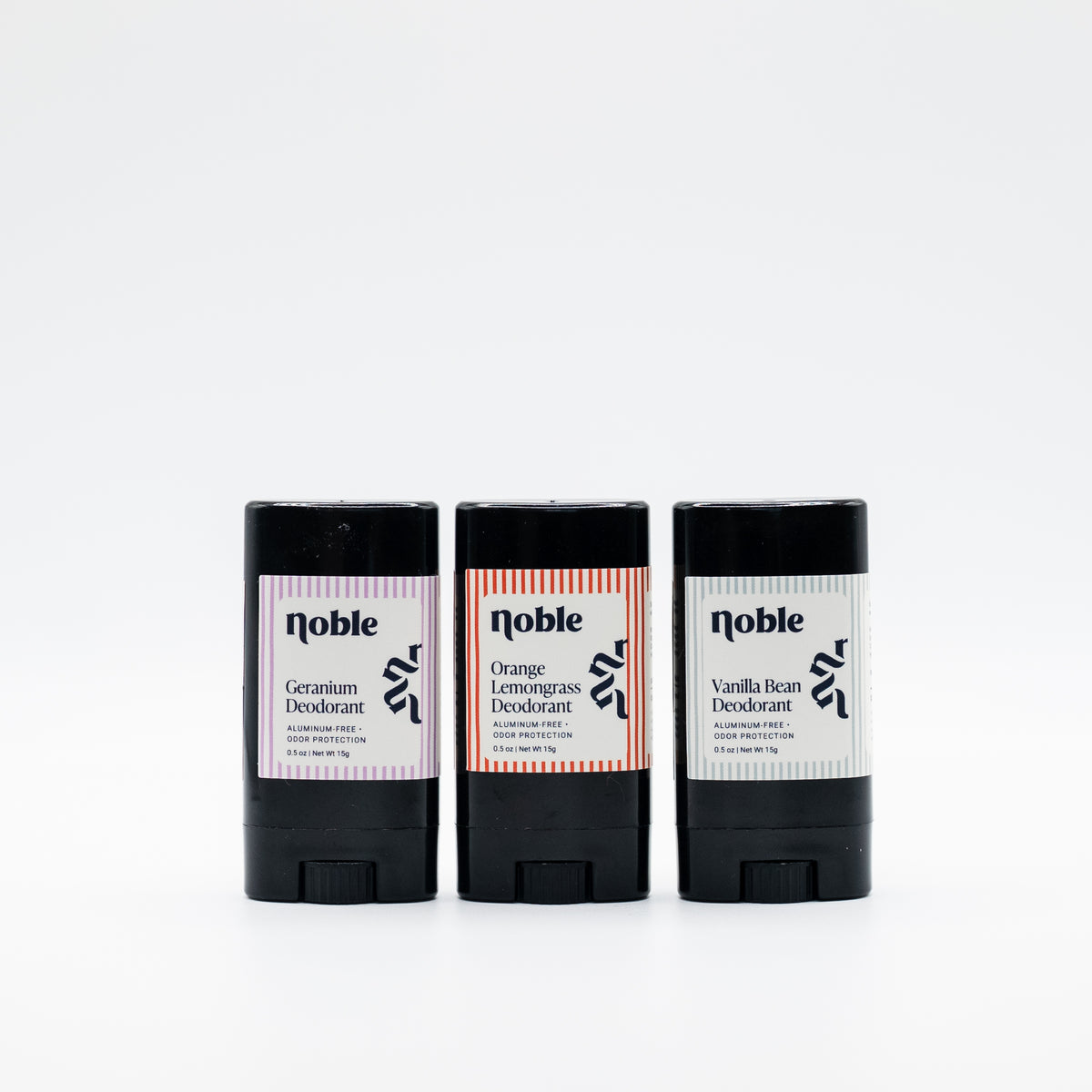 Three example Noble Skin Co. travel deodorants in assorted scents