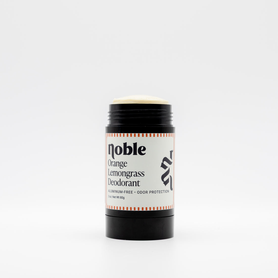 A single stick deodorant container on a clean white background. The product is Noble Orange Lemongrass Deodorant, featuring a black plastic stick with a cream-colored top and a white paper label with black text and orange-red striped accents.