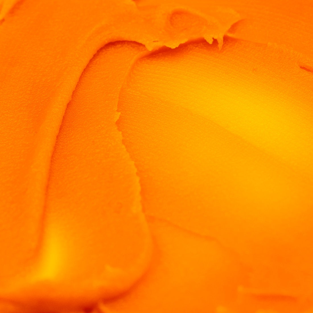 Texture of Noble Antioxidant Repair Balm spread across a light surface.