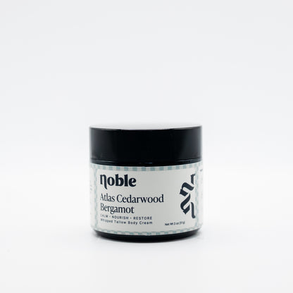 Noble Skin Co. Atlas Cedarwood Bergamot 2 oz amber jar with black lid