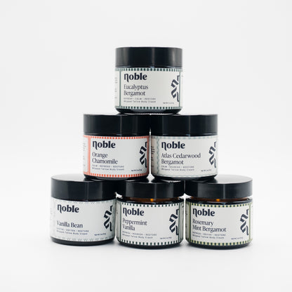Six Noble Skin Co. 2 oz body tallow jars shown as scent inspiration; choose three available scents for the Body Tallow Trio.