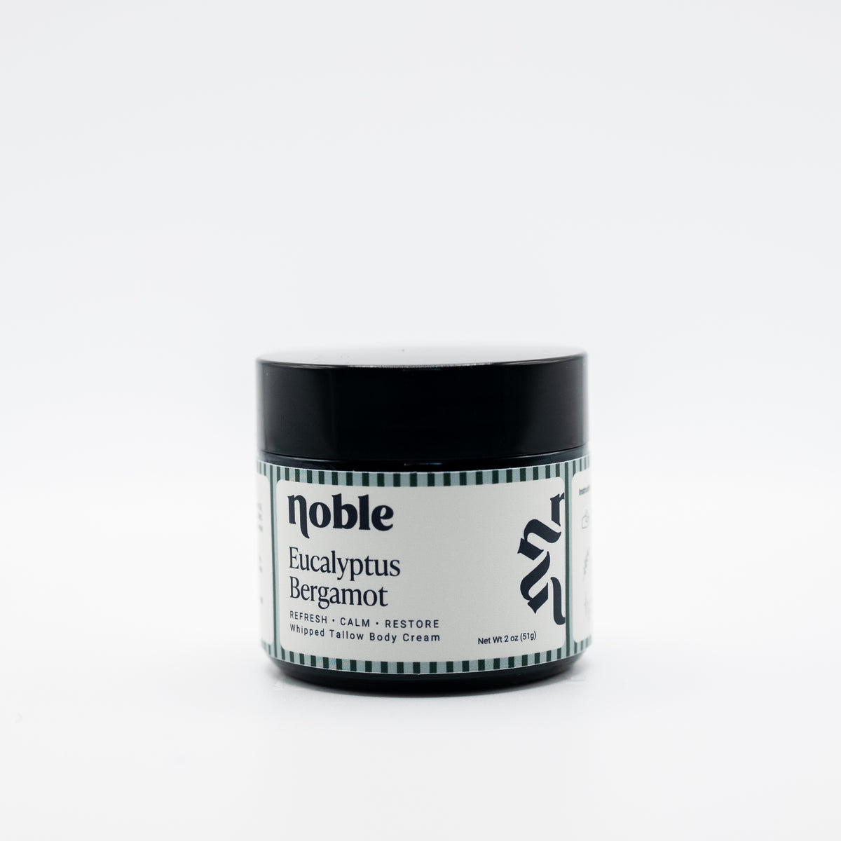 Noble Skin Co. Eucalyptus Bergamot 2 oz amber jar with black lid
