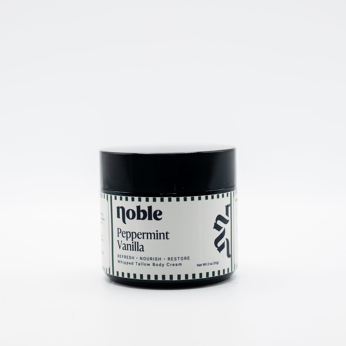 Noble Skin Co. Peppermint Vanilla 2 oz amber jar with black lid