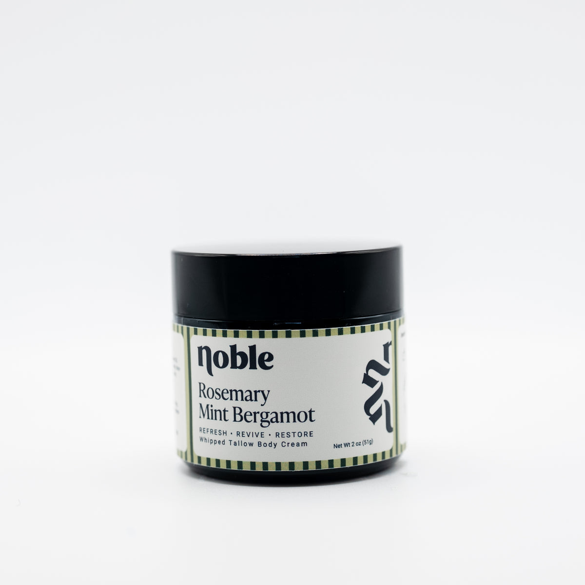 Noble Skin Co. Rosemary Mint Bergamot 2 oz amber jar with black lid