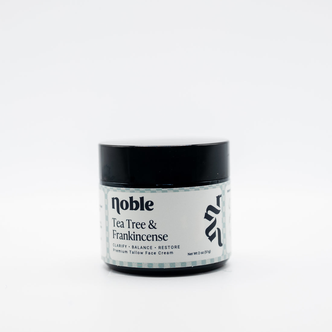 Noble Skin Co. Tea Tree &amp; Frankincense 2 oz amber jar with black lid