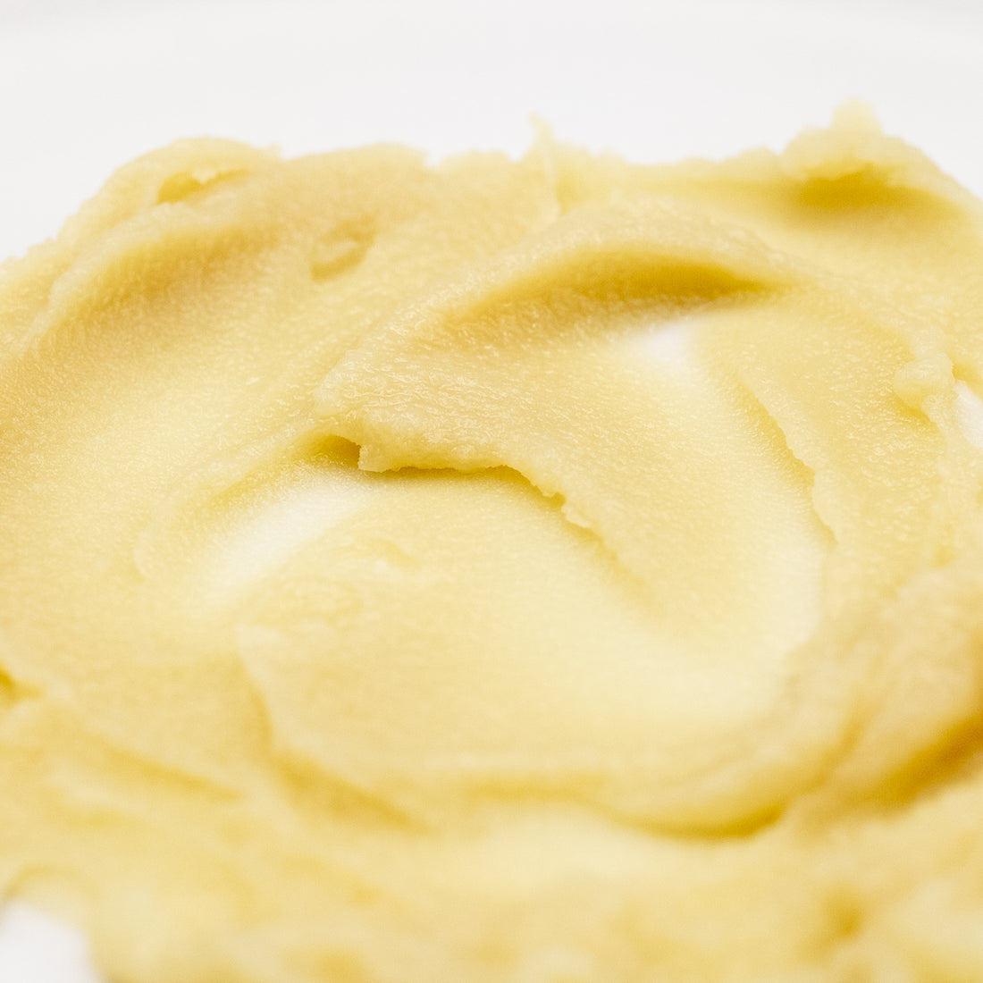 Pale golden tallow texture close-up.