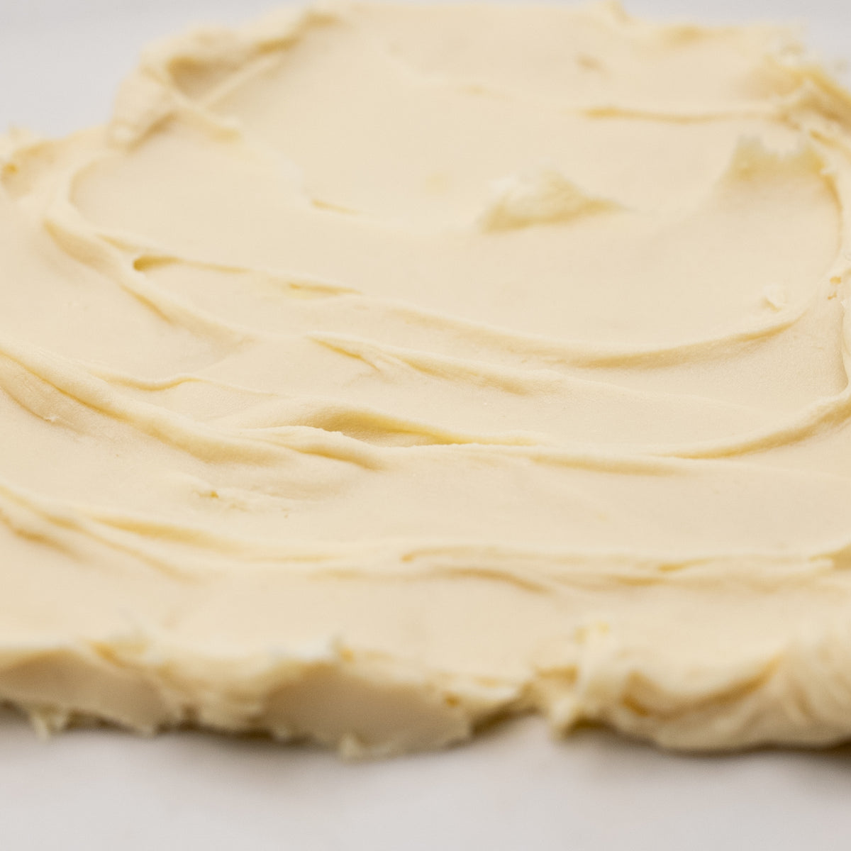 Close-up of pale golden cream texture.